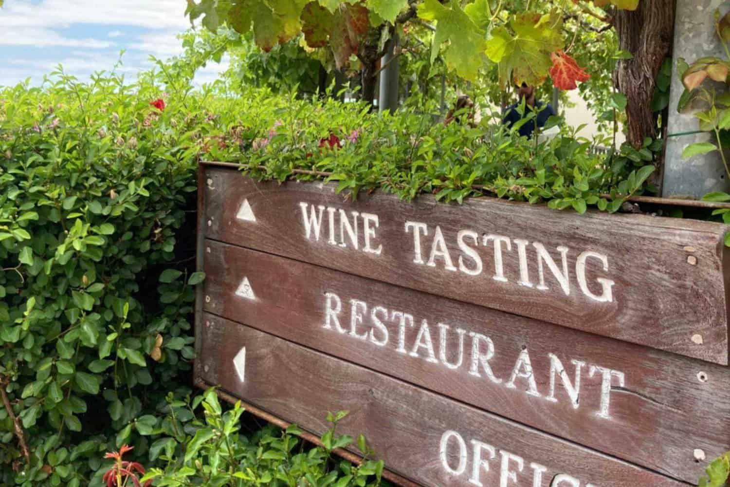 Signs outside vineyard pointing people towards the wine tasting room on a best wine tours Margaret River